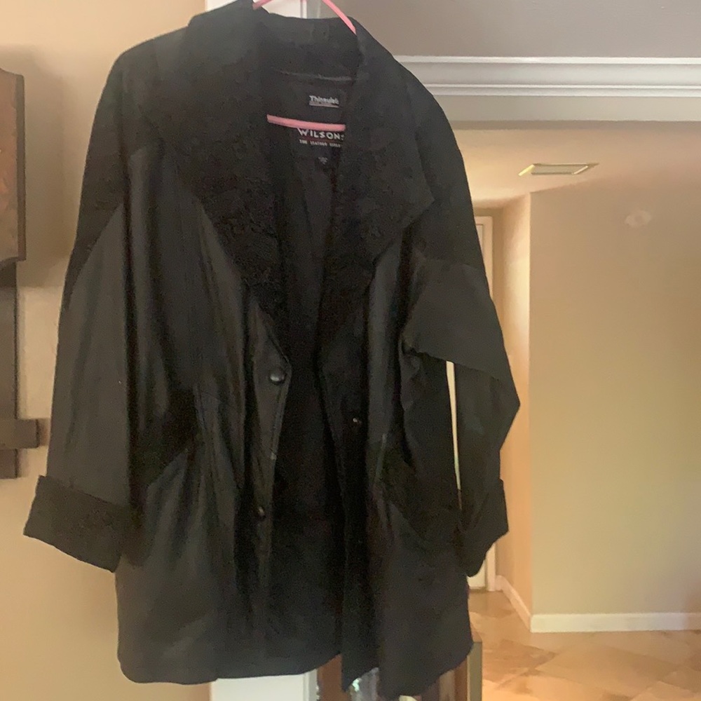 Wilson’s long leather jacket